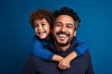 Obraz premium Portrait of happy father with his son on color background, closeup. Ai generated.