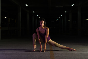 Talented female dancer dancing in the street at night