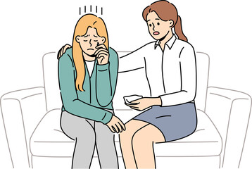 Crying woman at reception of psychologist consoling patient sitting on couch and experiencing stress