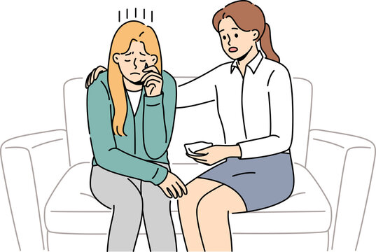 Crying woman at reception of psychologist consoling patient sitting on couch and experiencing stress