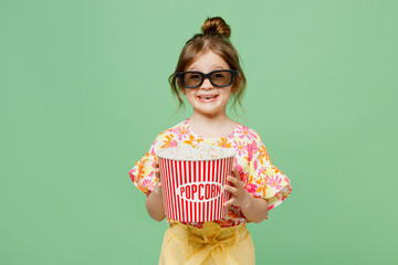 Young smiling cheerful satisfied happy child kid girl 6-7 years old in 3d glasses watch movie film...