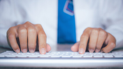 Businessman using keyboard computer working on office table. copy space.