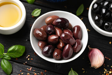 Assortment of fresh green, kalamata and black olives in bowl. Healthy snack