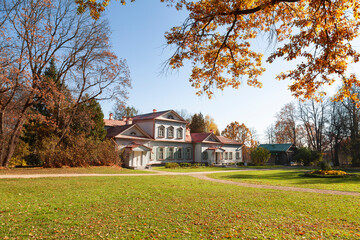 Fototapeta na wymiar The main manor house in the Abramtsevo Museum-Reserve in sunny autumn day. Moscow region, Russia