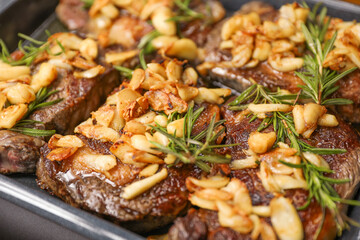 An exquisite steak on a plate adorned with garlic and fresh greens, representing indulgence, culinary excellence, and a balanced gourmet experience