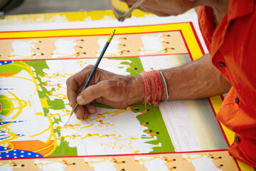 Part view of a man painting