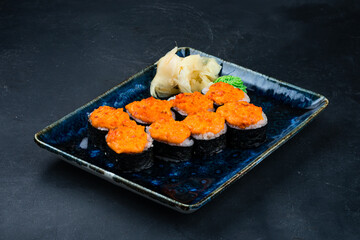 Sushi roll set with salmon, tuna, avocado, Philadelphia cheese, cucumber with ginger and wasabi, Japanese hot sushi.