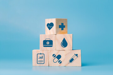 Stacking wooden block cube which print screen health care and medical icons for healthy and...