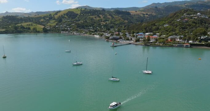 Aerial: Harbour in seaside town of Akaroa, Canterbury, New Zealand