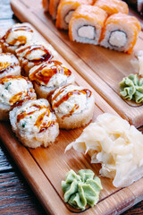 Sushi on a wooden table in a restaurant.