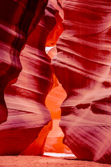 Woman is photographing the incredible sand stone formations build by flash floods at antelope...