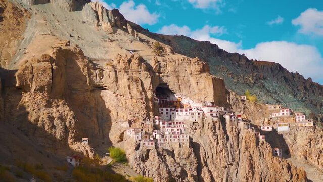 View of the Phugtal monastery built inside the mountain cave during the sunset near Purne in Zanskar Valley, Ladakh, India. Monastery built inside mountains in Zanskar. Remote monastery in India.