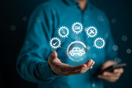 Car Service concept and technology on virtual screen, Serviceman working onsite use tablet check service cycle for maintenance of car with the engine room in the background, Smart work of car service