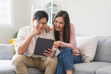 financial in family concept, Happy Asian husband and wife calculating income and bills to plan for...