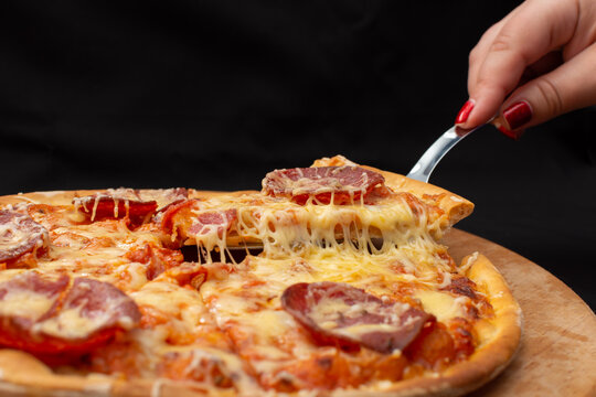 Take a slice of pizza with a special spatula