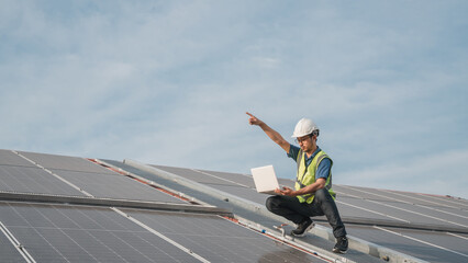 Service engineer checking solar cell on the roof for maintenance if there is a damaged part. Engineer worker install solar panel. Clean energy concept.