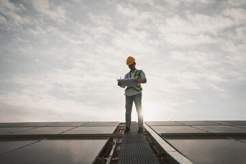 Service engineer checking solar cell on the roof for maintenance if there is a damaged part. Engineer worker install solar panel. Clean energy concept.