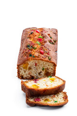 Fresh sliced homemade fruit cake with candied fruits isolated on white