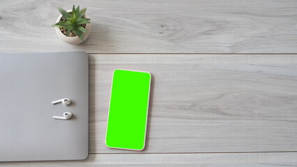 Phone mobile telephone with a vertical green screen technology cell phone on white background isolate