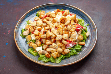 front view caesar salad with sliced vegetables and rusks on dark background vegetable salad food lunch meal rusk taste