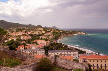 Fototapeta na wymiar View from Forte Falcone over City of Portoferraio to Padulella beach and Capo D' Enfola
