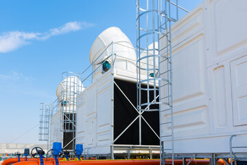 large cooling towers in blue sky