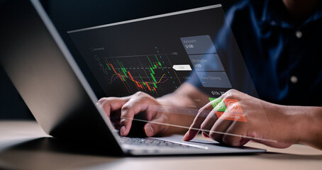 Concept Planning and strategy, Stock market, Hands of businessman working at home. Technical price graph and indicator, Red and green candlestick chart and stock trading computer screen.