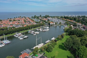 Fototapeta na wymiar Drone overview photo of Medemblik, the Netherlands. This is a small town on the Ijsselmeer with many opportunities for water sports enthusiasts. There are also many old historic buildings