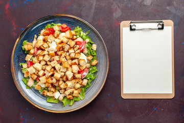 top view caesar salad with sliced vegetables and rusks on the dark desk vegetable salad food lunch meal rusk taste