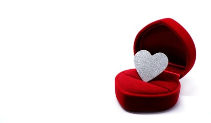  Silver glitter heart in wedding ring box. Valentines day present concept.