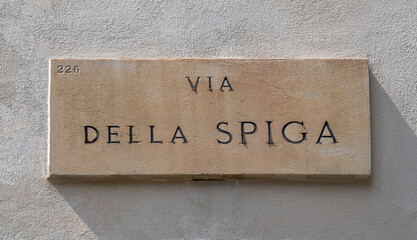 Marble sign of the famous Via della Spiga, one of the streets in the historic center of Milan that...
