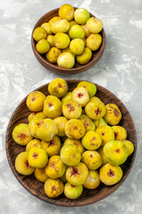 top view fresh sweet figs inside brown plate on light background tree plant fruits fresh mellow taste