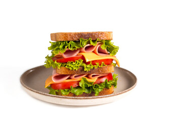 Club sandwich with ham, cheese, tomato and lettuce. 