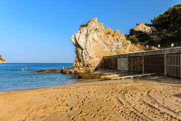 Very old boat houses on the beach in Cala San Vicente Ibiza Spain 2