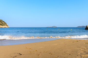 Fototapeta na wymiar Waves crash at the beach in Cala San Vicente Ibiza Spain