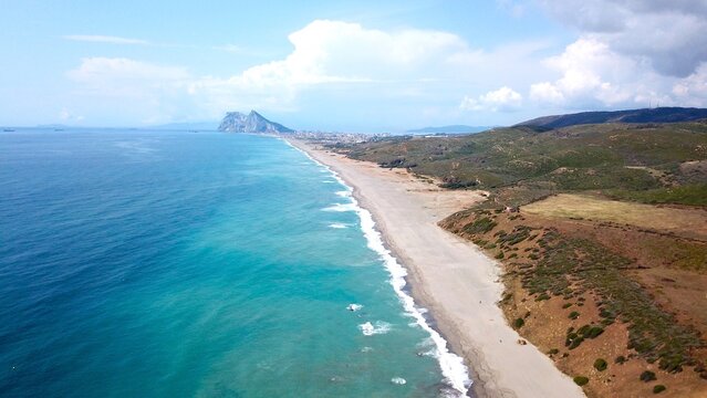 aerial view along the beach near La Alcaidesa with a view towards the Rock of Gibraltar and Africa at the horizon, Playa de la Hacienda, Mediterranean Sea, Andalusia, Malaga, Spain