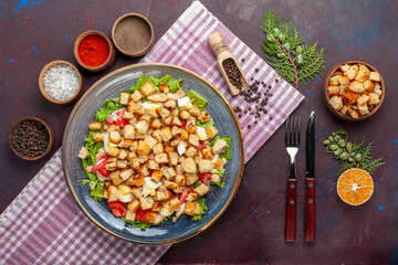 top view tasty caesar salad with rusks and seasonings on dark desk salad food meal lunch vegetables