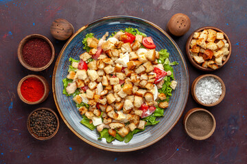 top view tasty caesar salad with seasonings on dark background vegetable salad food lunch meal rusk taste
