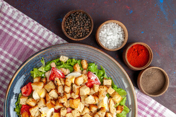 top view tasty caesar salad with seasonings on the dark desk salad food meal lunch vegetables