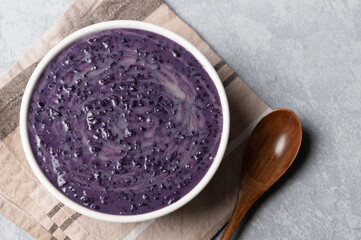 Ube Champorado or tsampurado (topped milk ) is a twist to the famous sweet chocolate rice porridge in Philippine cuisine