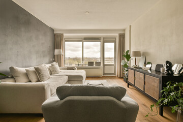 a living room with two couches and a television set on the wall in front of the sofa is empty