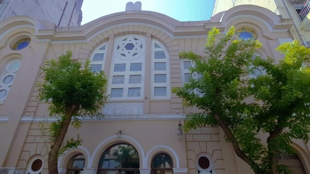 Thessaloniki, Greece low-angle pan on the facade of 1920s Monasteriotes Jewish Synagogue, the only one to have survived the Holocaust.