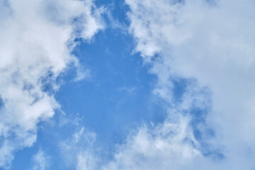 White clouds against blue sky.