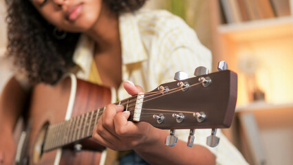 Guitar singing. Music leisure. Creative lifestyle. Talented woman playing song performing acoustic...