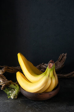 front view fresh yellow bananas on the dark background exotic ripe food darkness taste photo tropical fruit