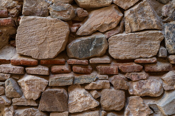 Old Wall Of Stones And Rocks Of Different Sizes. Backgrounds And Textures.
