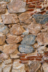 Vertical Image Of An Old Stone, Cement And Brick Wall. Background And Texture