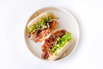 Steamed buns Bao with pulled beef and iceberg lettuce