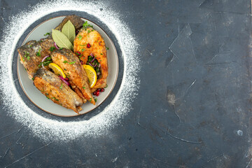 top view fried fish slices with lemon slices on dark background seafood color salad food meat ocean health meal free space