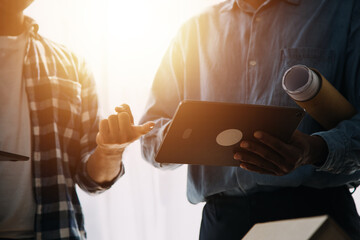 Architect having a meeting with construction team on site
